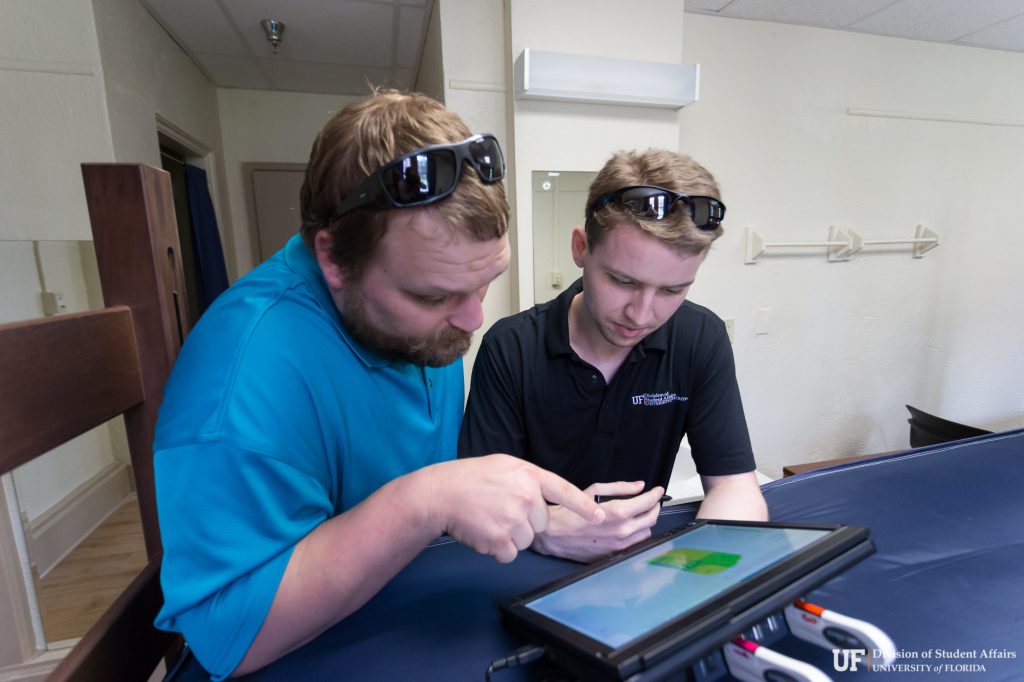 Steven Baggett and Daniel Giampaolo perform a wireless survey of Buckman Hall